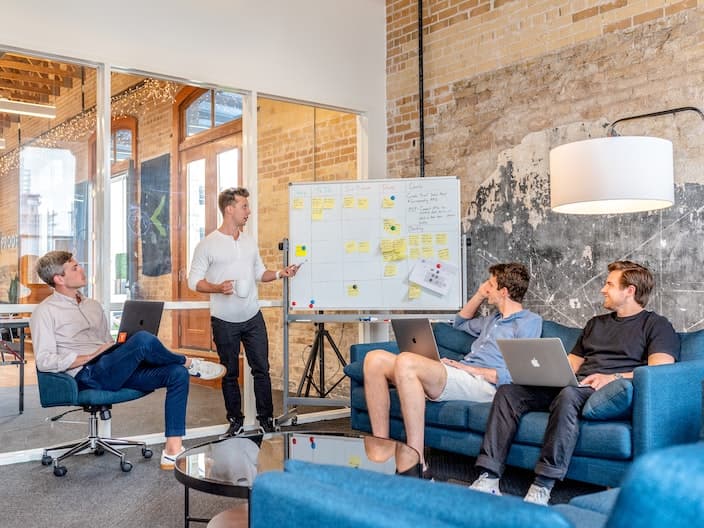 team meeting with whiteboard
